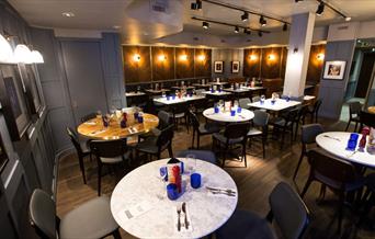 PizzaExpress dining with round table and dim lights
