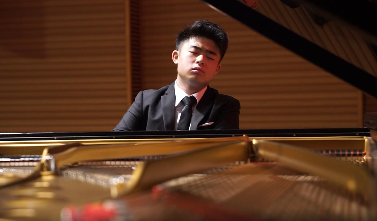 Image of pianist Aidan Chan bringing sharing a range of works from around the world