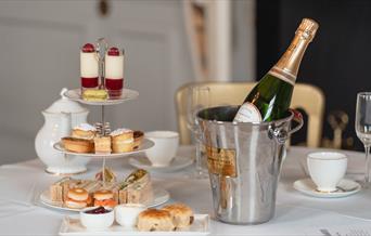 Indulge in the most sumptuous afternoon tea offering a selection of delicate finger sandwiches, homemade scones with clotted cream and jam