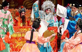 Discover and witness preparations, including applying the signature Chinese opera makeup, doing the hair, putting on the costumes, and find out about