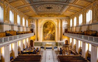 The beautiful neoclassical interior of the Chapel of St Peter and St Paul at the Old Royal Naval College in Greenwich