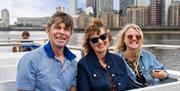 Family enjoying a Thames River Sightseeing cruise on the River Thames