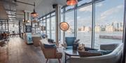 The Sail Loft has panoramic views of the river Thames from its floor to ceiling windows.