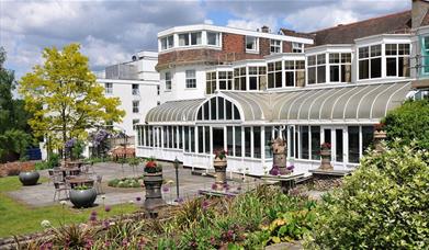 Image shows the grounds and entrance of The Bromley Court Hotel