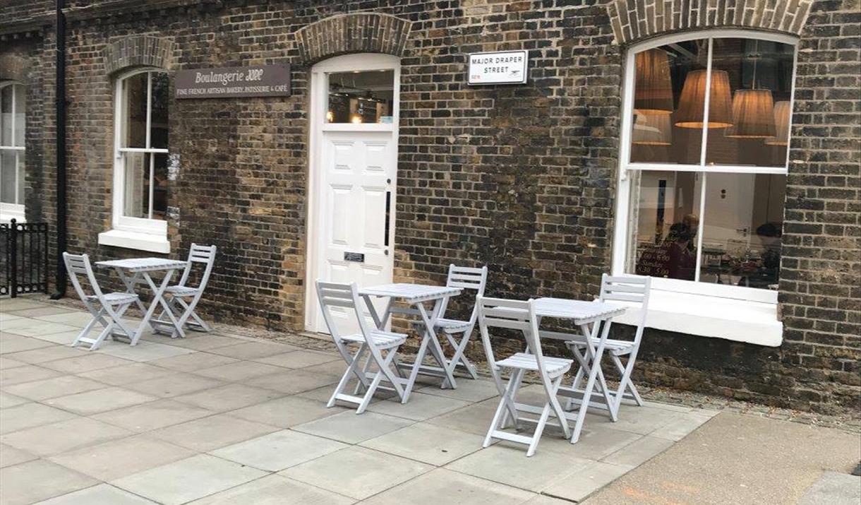 Jade Boulangerie is based in a brick finished building within the Royal Arsenal with a white entry door. There is outside seating available as well a Jade Boulangerie is based in a brick finished building within the Royal Arsenal with a white entry door. There is outside seating available as well a